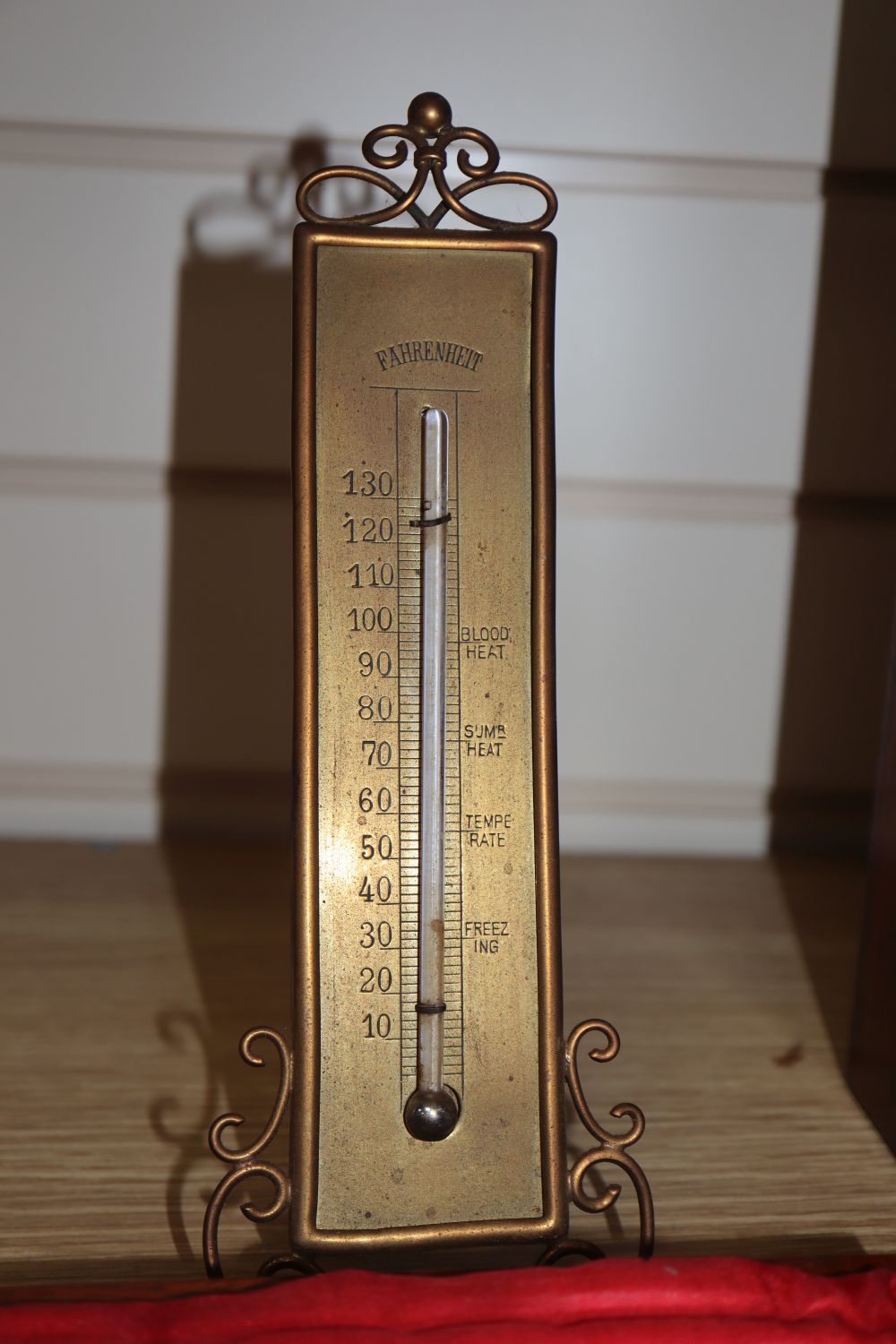 A cased microscope, a cased Sikes hydrometer and two thermometers